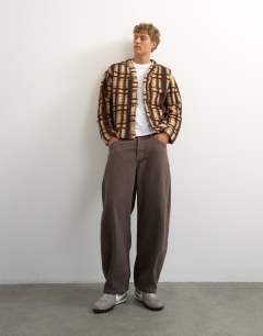 Model wearing Boxy fit borg check cardigan in brown