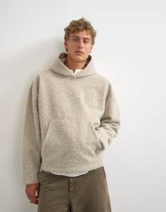 Model wearing Boxy fit brushed borg hoodie in stone