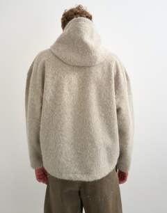 Model wearing Boxy fit brushed borg hoodie in stone