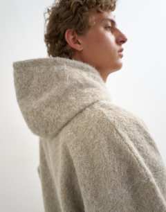 Model wearing Boxy fit brushed borg hoodie in stone