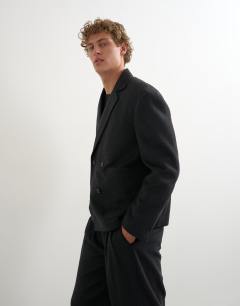 Model wearing Boxy fit double breasted textured blazer in charcoal