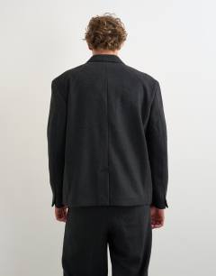 Model wearing Boxy fit double breasted textured blazer in charcoal