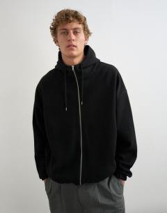 Model wearing Boxy fit funnel neck hoodie in black
