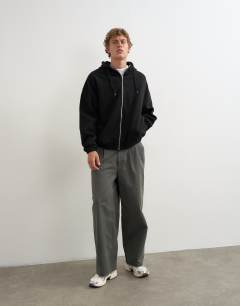 Model wearing Boxy fit funnel neck hoodie in black