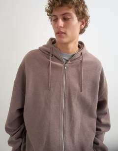 Model wearing Boxy fit funnel neck hoodie in putty