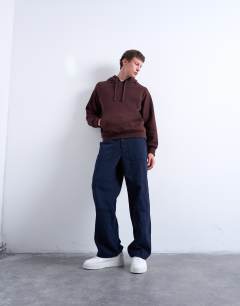 Model wearing Boxy fit hoodie in brown