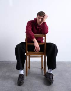 Model wearing Boxy fit hoodie in burgundy