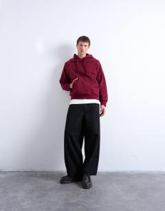 Model wearing Boxy fit hoodie in burgundy