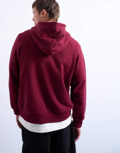 Model wearing Boxy fit hoodie in burgundy