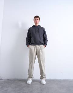 Model wearing Boxy fit hoodie in charcoal