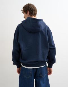 Model wearing Boxy fit hoodie with front NY chenille patch in navy