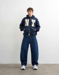 Model wearing Boxy fit hoodie with front NY chenille patch in navy