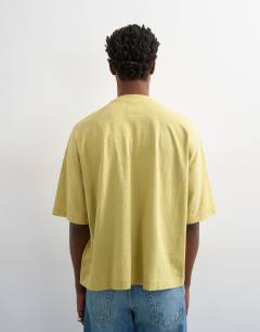 Model wearing Boxy fit in washed yellow
