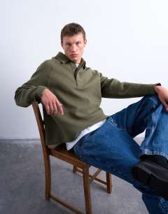 Model wearing Boxy fit  polo sweat in khaki in scuba-style fabric