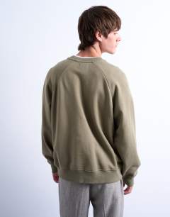 Model wearing Boxy fit raglan sweatshirt in khaki