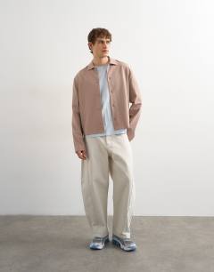 Model wearing Boxy fit t-shirt in washed blue