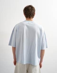 Model wearing Boxy fit t-shirt in washed blue