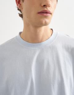 Model wearing Boxy fit t-shirt in washed blue
