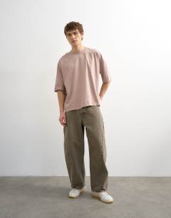 Model wearing Boxy fit t-shirt in washed pink