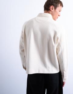 Model wearing Boxy fit textured raglan polo sweat in ecru