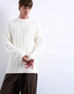 Model wearing Cable knit jumper in cream