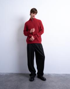 Model wearing Cable knitted zip through funnel neck cardigan in red