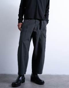 Model wearing Canvas barrel cargo trouser in washed black