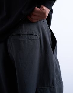Model wearing Canvas barrel cargo trouser in washed black