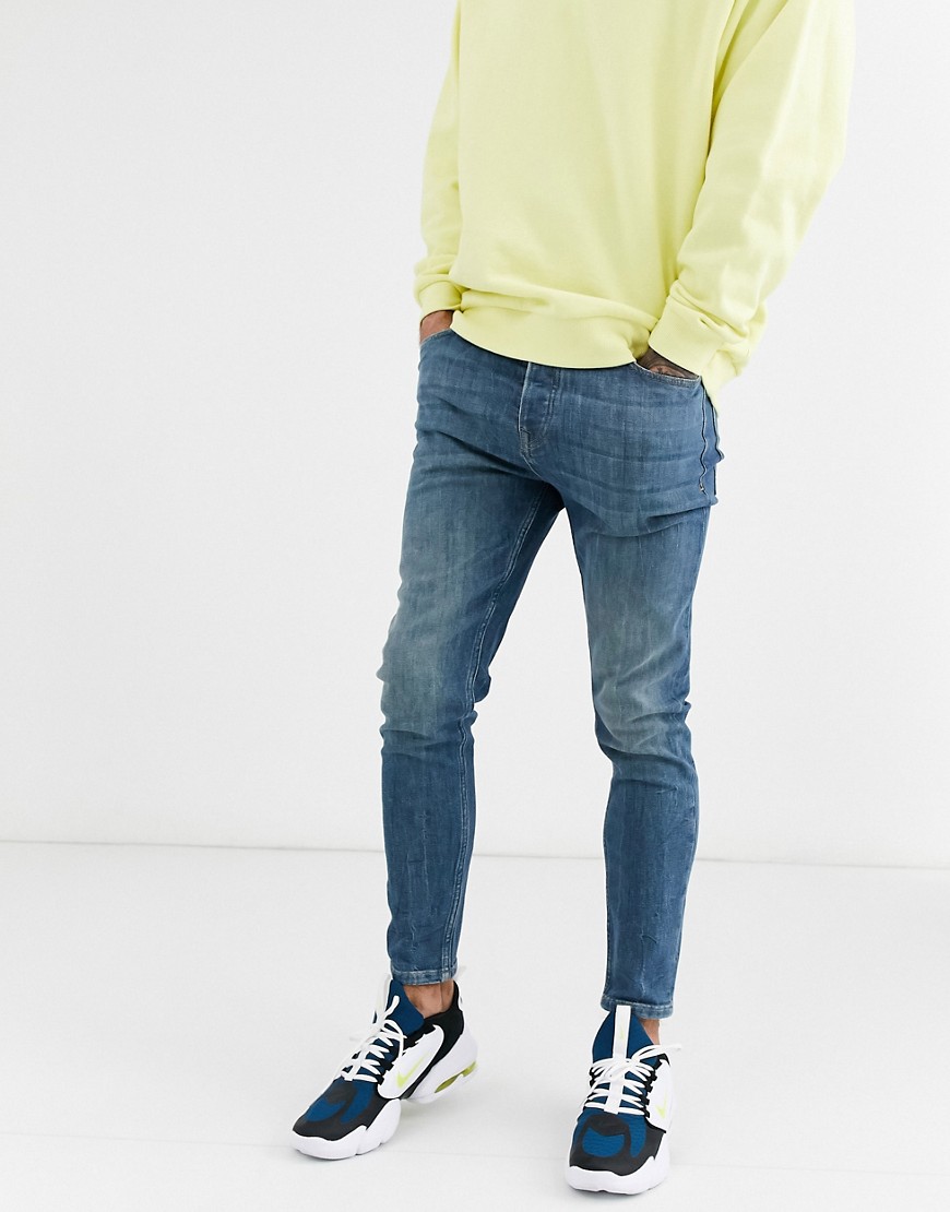 Topman carrot fit jeans in washed blue
