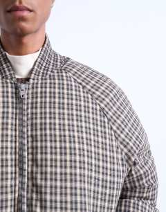 Model wearing Checked puffer in black