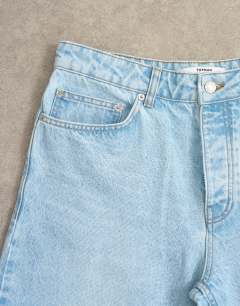 Model wearing Circular design rigid baggy jean in light wash