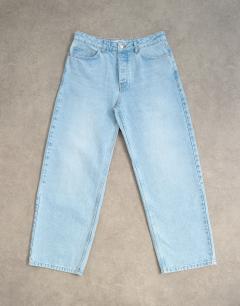 Model wearing Circular design rigid baggy jean in light wash