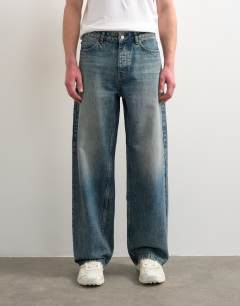 Circular design rigid baggy jean in mid wash tint