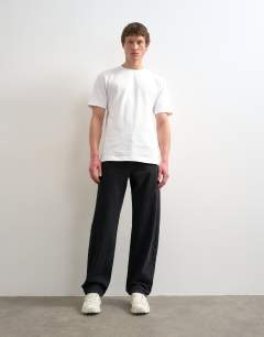 Model wearing Circular design rigid straight jean in washed black