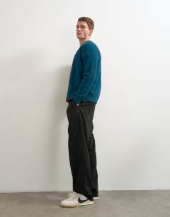 Model wearing Classic fit brushed knitted cardigan in dark teal