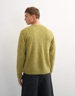 Model wearing Classic fit brushed knitted cardigan in green