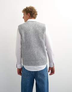Model wearing Classic fit button through knit tank in grey