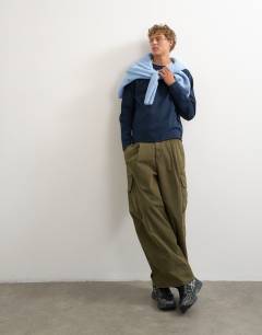 Model wearing Classic fit crop raglan sweatshirt with raw hem in navy