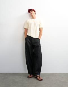 Model wearing Classic fit distressed raw hem t-shirt in ecru