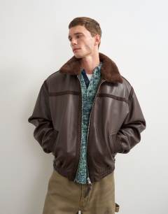 Model wearing Classic fit faux leather bomber jacket with detachable faux fur collar in chocolate brown