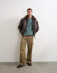 Model wearing Classic fit faux leather bomber jacket with detachable faux fur collar in chocolate brown