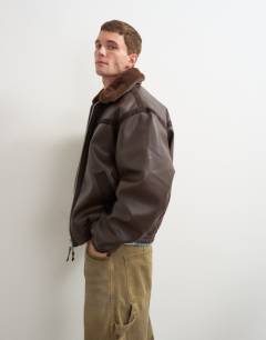 Model wearing Classic fit faux leather bomber jacket with detachable faux fur collar in chocolate brown