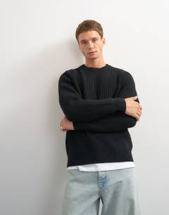 Model wearing Classic fit fisherman knit jumper in black
