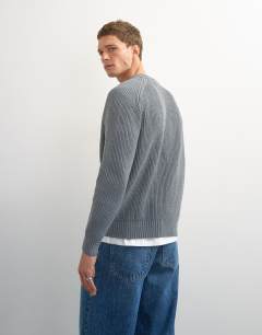 Model wearing Classic fit fisherman knit jumper in grey