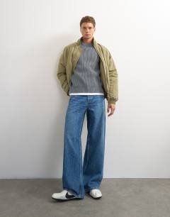 Model wearing Classic fit fisherman knit jumper in grey