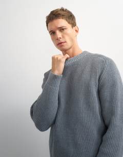 Model wearing Classic fit fisherman knit jumper in grey