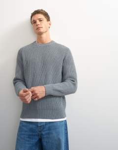 Model wearing Classic fit fisherman knit jumper in grey