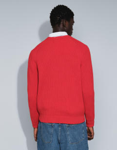 Model wearing Classic fit fisherman knit jumper in red