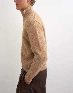 Model wearing Classic fit funnel neck nep jumper with double zip in stone