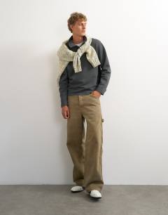 Model wearing Classic fit funnel neck sweatshirt in charcoal
